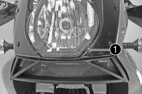 ELECTRICAL SYSTEM 141 The light-dark boundary must lie exactly on the lower mark when the motorcycle is ready to operate with the rider mounted along with any luggage and a passenger if applicable.