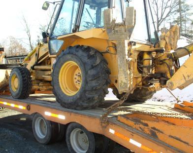 Heavy Haul Transporting Heavy Equipment Heavy equipment or machinery with crawler tracks or wheels must