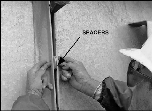 To increase clearance, add spacers at fan ring joints. Use a chisel to maintain correct distance until bolts on ring are re-tightened (See Figure 12).