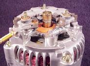 Once going, the alternator bleeds off some of the current from the stator circuit and thus becomes self sustaining The slip rings and brushes are the pathway allowing current flow through the rotor.