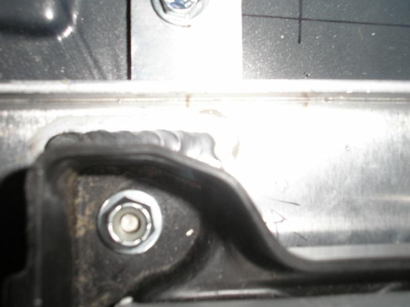 The 1/4-20 nylon lock nuts and 1/4 SAE washers will install from the top. Refer to picture # 5, 6 & 7.