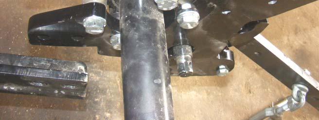 472 Bushing NOTE: Saddle must be offset towards the inside of the Tractor LH Subframe Hex Head Cap Screw 14-2 x 60, Disc- Lock Washer 9/16, 4 places Rear of Tractor Repeat previous step for
