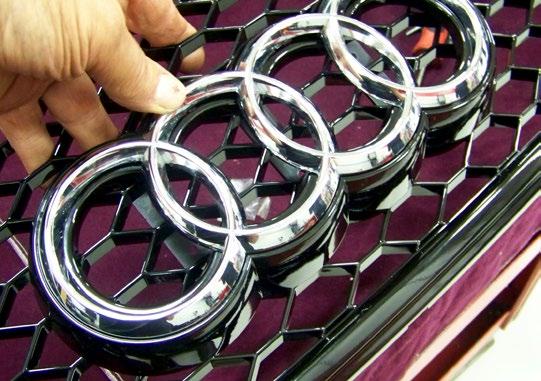 Step 21 Snap the chrome rings into the emblem holder