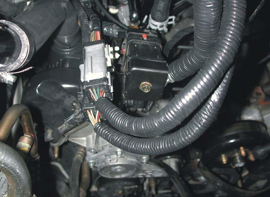 1.2.3 Electrical Connectors Document 1930054 1. Disconnect the two small black and gray electrical plugs near the heater core (Figure 1.5). 2.
