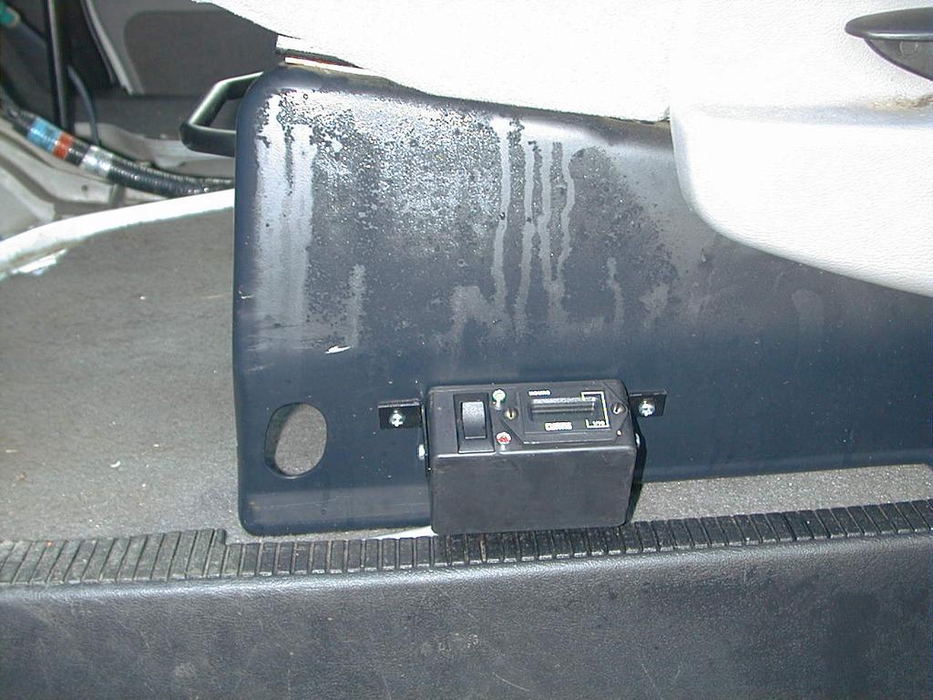 Figure 4.1 Mounting the control unit 5. Route the wires down toward the step well and along the bottom, behind the kick panel and up under the dash. Use tape to hold the wires in position. 6.
