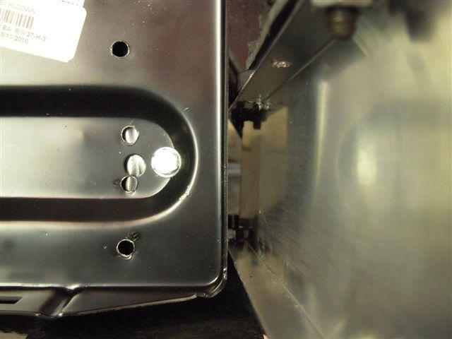 d. Attach the cut off lower mounting bracket of the battery tray to the to the original mounting points on the lower engine compartment wall.