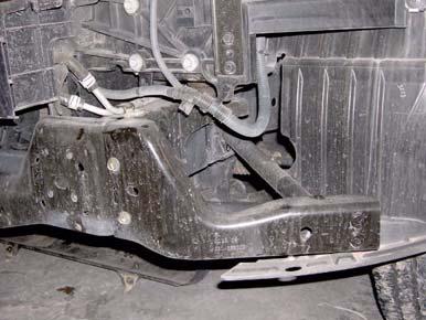 Remove six bolts, four nuts, and two side bumper braces from front bumper and side impact braces.