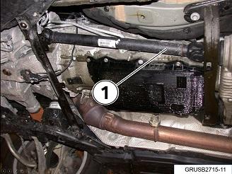 Hold the front driveshaft and manually spin the rear wheels (1). The rear driveshaft needs to spin.