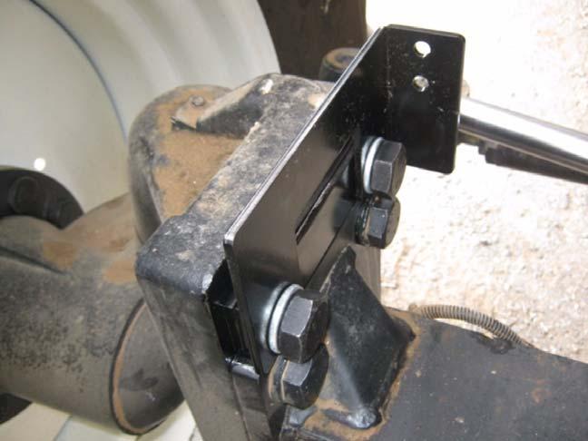 See Figure 3-3 Figure 3-3 Tightening the Bracket Bolts 5.