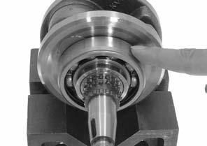 Also check that bearing inner races fit tightly in the crankshaft. Replace crankshaft if the outer race does not turn smoothly, quietly or if the inner race fits loosely in the crankshaft.