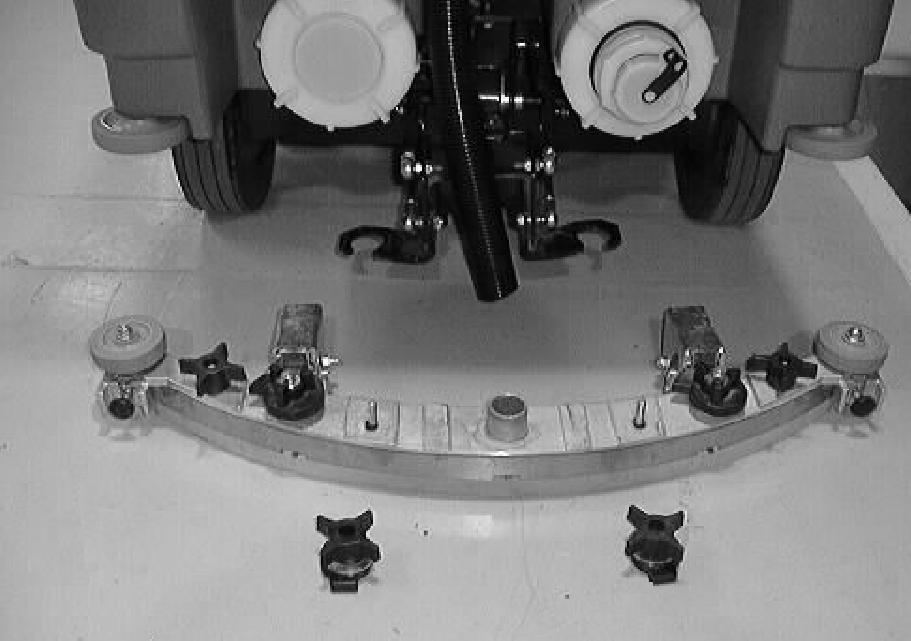 MAINTENANCE REAR SQUEEGEE ASSEMBLY The squeegee assembly channels water into the vacuum fan suction. The front blade channels the water, and the rear blade wipes the floor.
