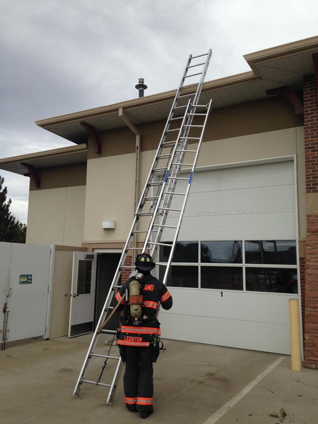 #13 Once the ladder is raised, hook it has high as you can on either the right or left of the extension ladder beam utilizing the open roof hooks.