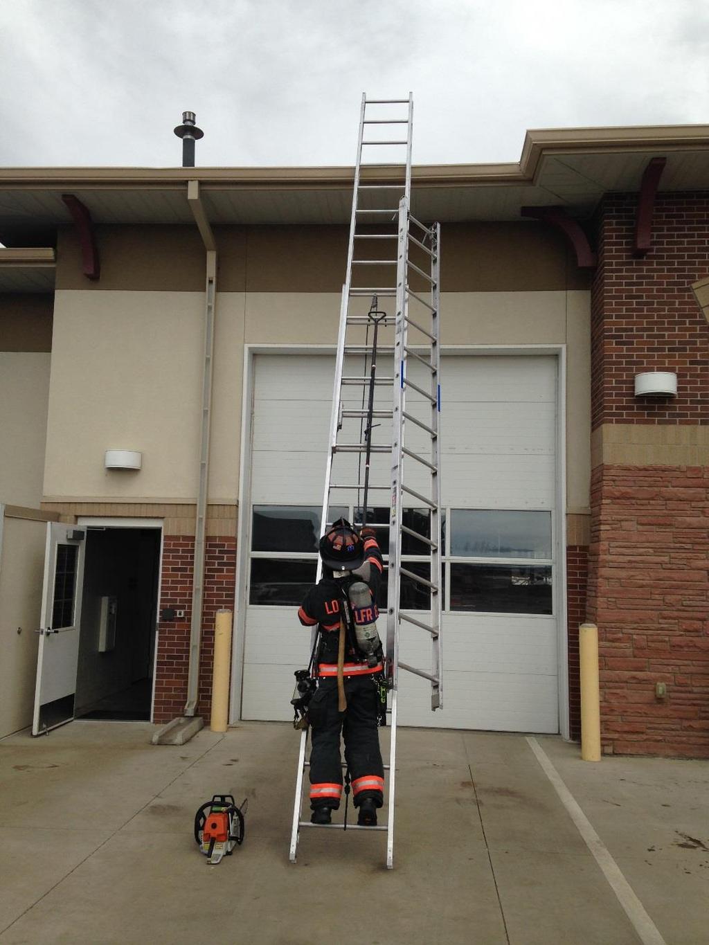 #14 Attach the trash hook to the highest point you can quickly reach in the middle of the extension ladder so that the climbing firefighter can easily control the roof hook and roof ladder as they