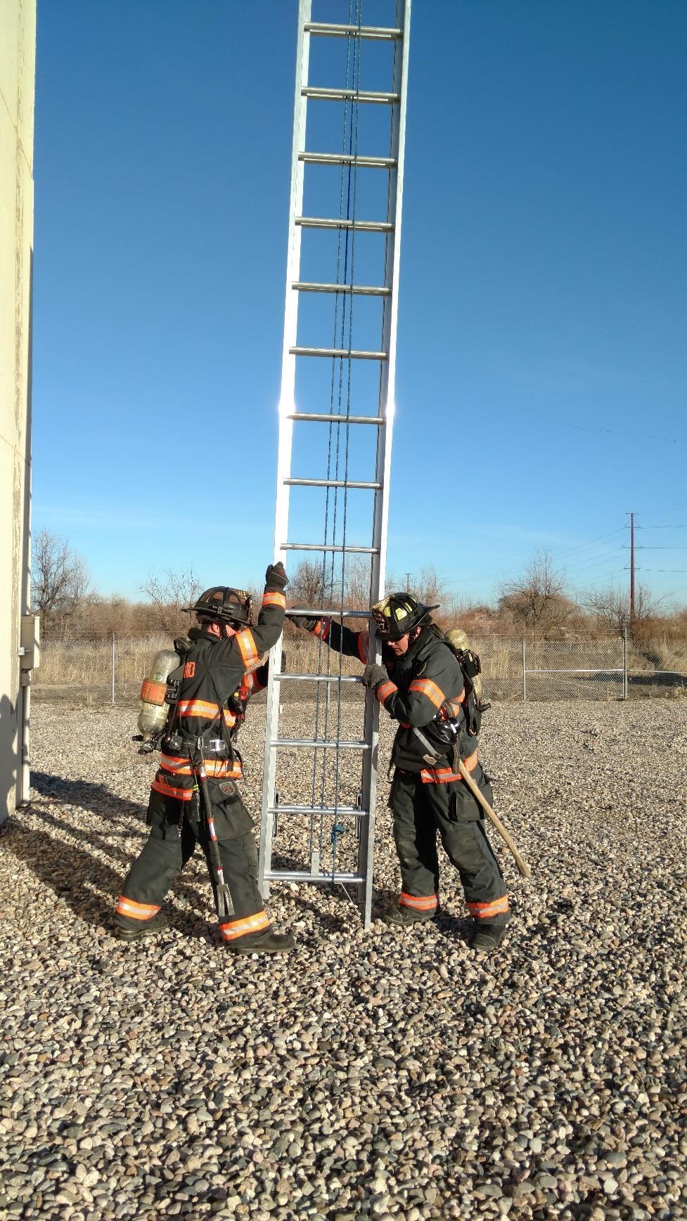 #4 The firefighters pivot the ladder into a position with the fly section facing away from the building.