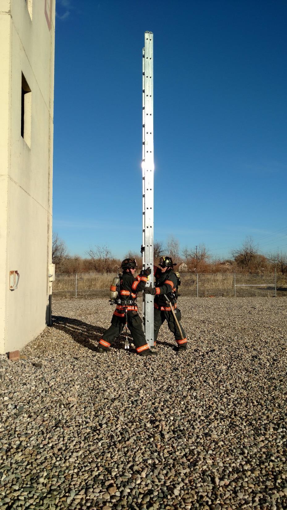 #5 Both of the firefighters will brace the ladder by placing a beam on the side of their leg (each beam is braced).