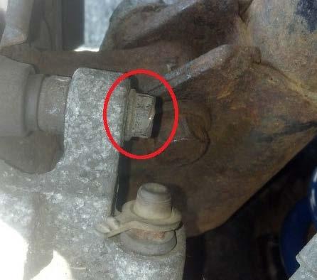 3. Pull the caliper off and secure it in the top of the wheel well behind the strut as shown below. 4.