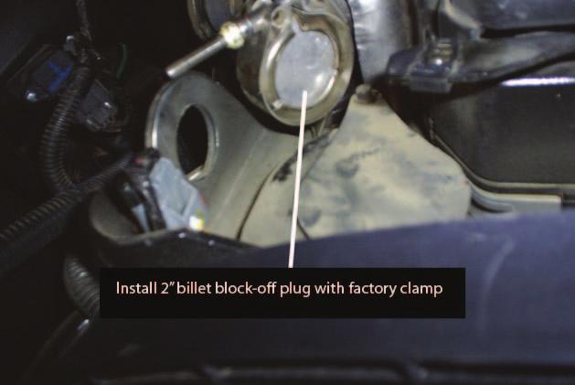 STEP 7 Install 2 billet block-off plug with factory clamp If
