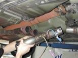 Install Y-pipe onto straight pipe or cat, sliding clamp on first.