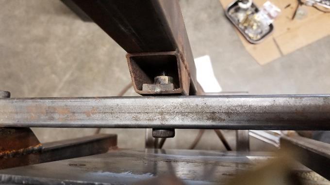 The pivot is formed by welding a section of 1 ½ square to the lift tube.