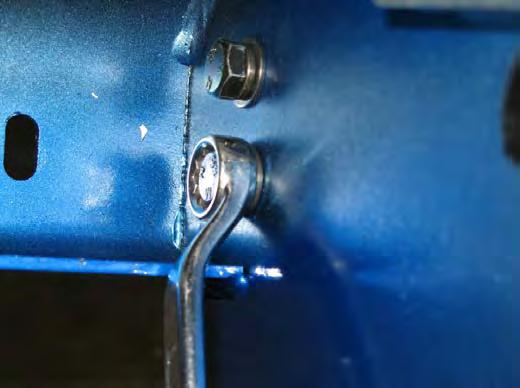 it back against the slam latch, pull the pad hard against the hinge bracket flange as shown. 57.