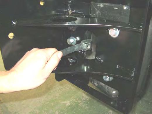 For pinning bolt from outboard of reinforcing bracket, fit cage nut plate assembly through into chassis end aperture as shown, then fasten in place through drilled pinning hole with M0 x