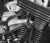 After waiting until the lifters bleed down 13 (when he can spin the pushrods with his fingers), he does the same on
