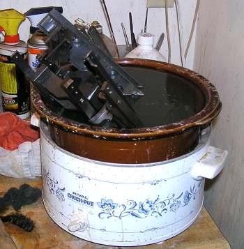 The parts were sprayed with degreaser, washed in hot soapy water and then cleaned in the pickling solution. The photo shows most the truck parts ( less the axels) in the crock pot.