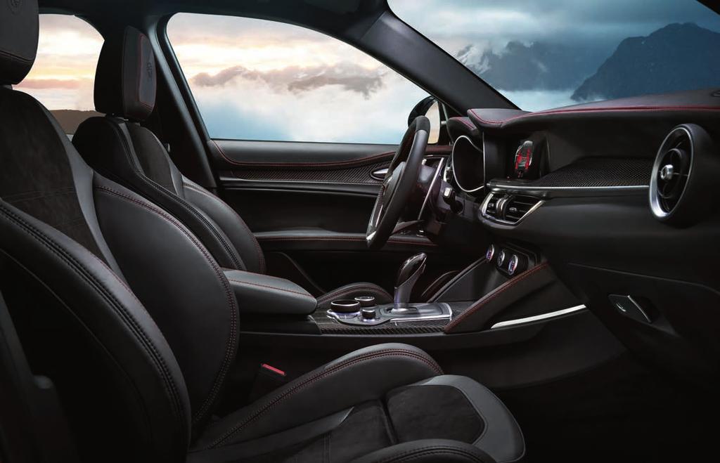 Enriching interior details include carbon fiber accents, steering column-mounted