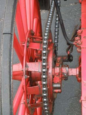 The wheels were wood-spoke buggy style and the sprockets on the rear wheels are attached with