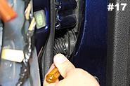 Use a flat head screwdriver to gently loosen part of the rubber boot attached to the car body.