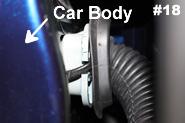 All you need to do is loosen it enough so that you can run the wiring through the door and out the rubber boot closest to the car body. See picture 17 and 18. 3.