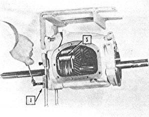 When separated, slide the main shaft and its components out the rear of the transmission case (Fig. 24).
