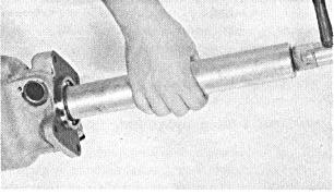 Reinstalling the Ring Gear and Main Shaft Replace the ring gear on the overdrive main shaft and lock it in place with a snap ring (Fig. 10). This ring is serviced in three different sizes.055",.