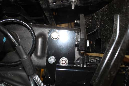10. On the driver side, install 1/2-13 x 1-1/2 bolt with lock washer into the hole and a 1/2-13 whiz nut