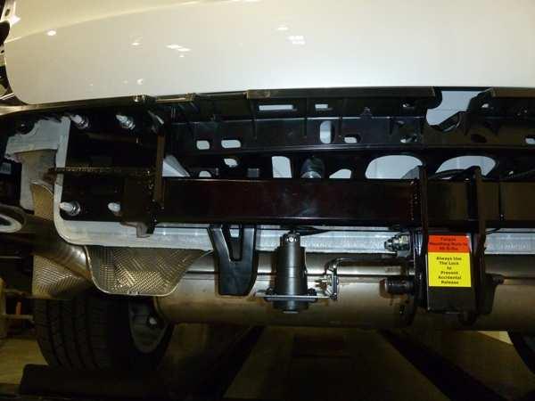 Install hitch beam onto the chassis studs.