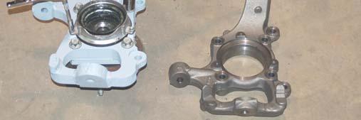 See Photo 45. 58. Remove the stock bearing assembly from the stock knuckle using a 18mm for the bearing and a 8mm for the locking hub mechanism.