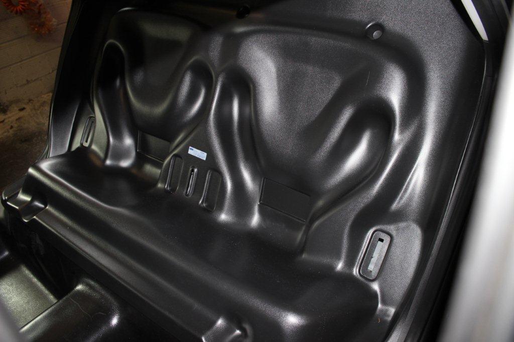 23) Using the supplied 1/4 x 1 HWH screws and 1/4 x1 flat washers, secure the seat to the vehicle in the recessed/dimpled areas on the back of the seat.