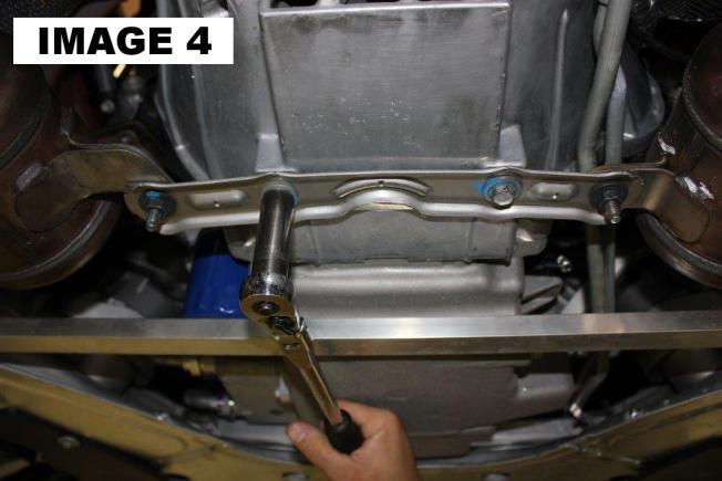 Remove the 6 bolts at the front of exhaust using a 15mm socket. (IMAGE 3) 6.
