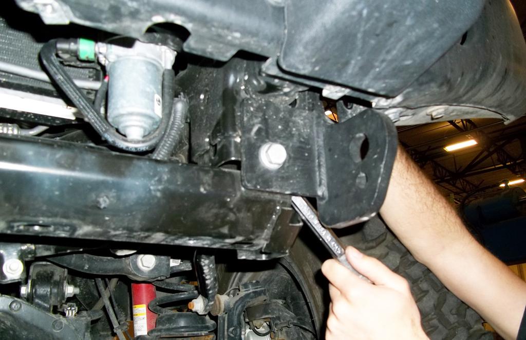 Place the main receiver brace around the subframe and then replace the 15mm (head) bolt, bolting through the main receiver brace, skid plate and into the subframe (Fig.