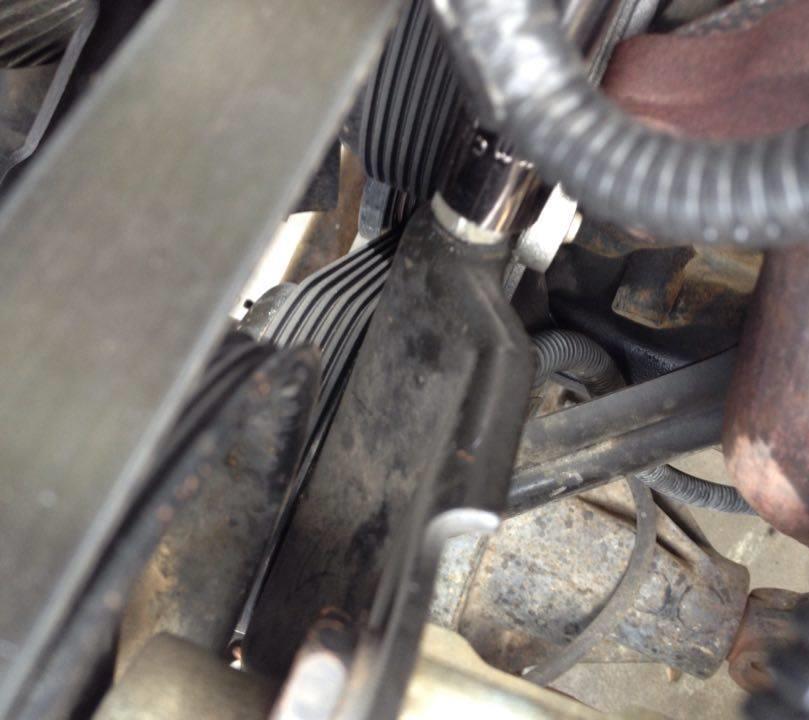 20. Next loosen bolt just above idler pulley to relieve tension on the serpentine belt (drive belt). Idler pulley 21.