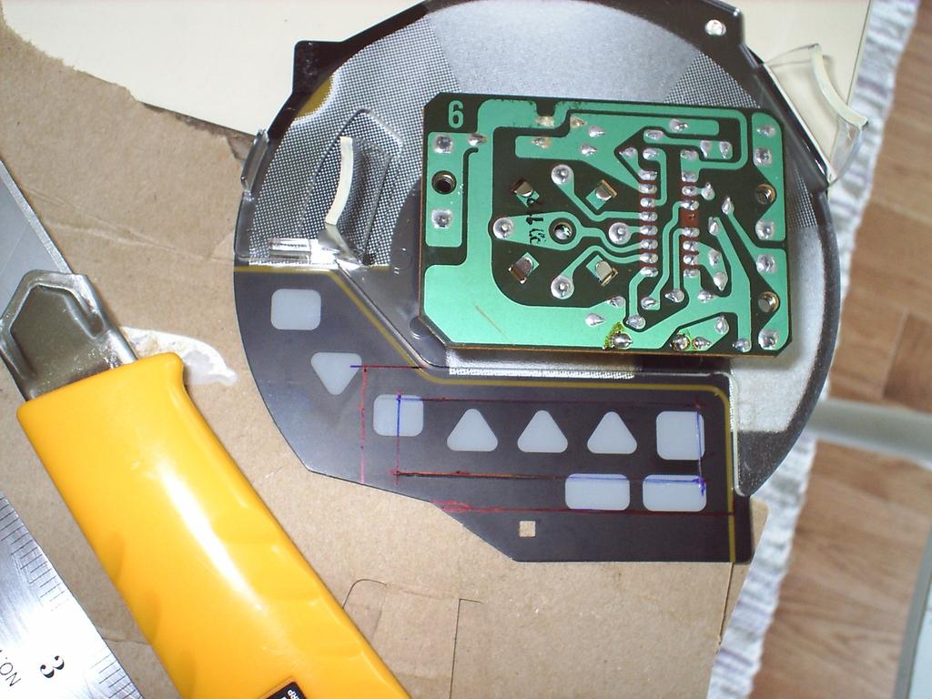 Here I mark the backside of the RPM meter of where the LCD will sit and also mark the location of the cutout.