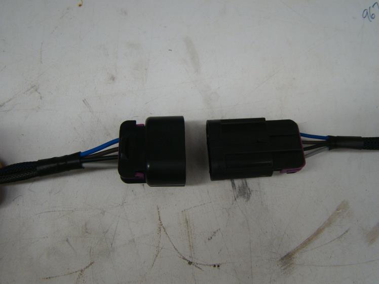 7) Insert the wires into the Delphi GT150 female connector body as shown in Photo 3. The pinout schedule is listed below for the connector body.