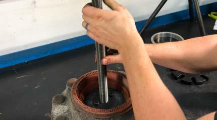 Using an impact wrench, alternate between the two hex flange screws applying even force until the clamp plate and disc wedge have come in to contact.