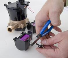 Figure 5 Removing Battery from Hinges 5 As close to the battery housing as possible, cut the battery wires one at a
