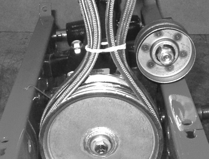 NOTE: The reverse drive belt (narrower belt) installs onto the flat transmission pulley with the back of the belt riding on the flat pulley surface. 47.