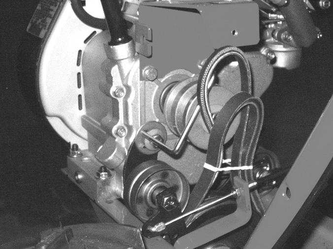 With the tines, wheels and engine installed, the drive clutch cables, belts, and belt guides remain to be installed. See Figure 14. 56.