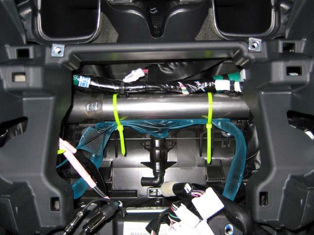 2. Mount the switch in the location of the blank knock-out (Fig. 1-28). NOTE: Make sure the solid arrow is pointing towards the front of the vehicle. 3. Reinstall center console subassembly. d.