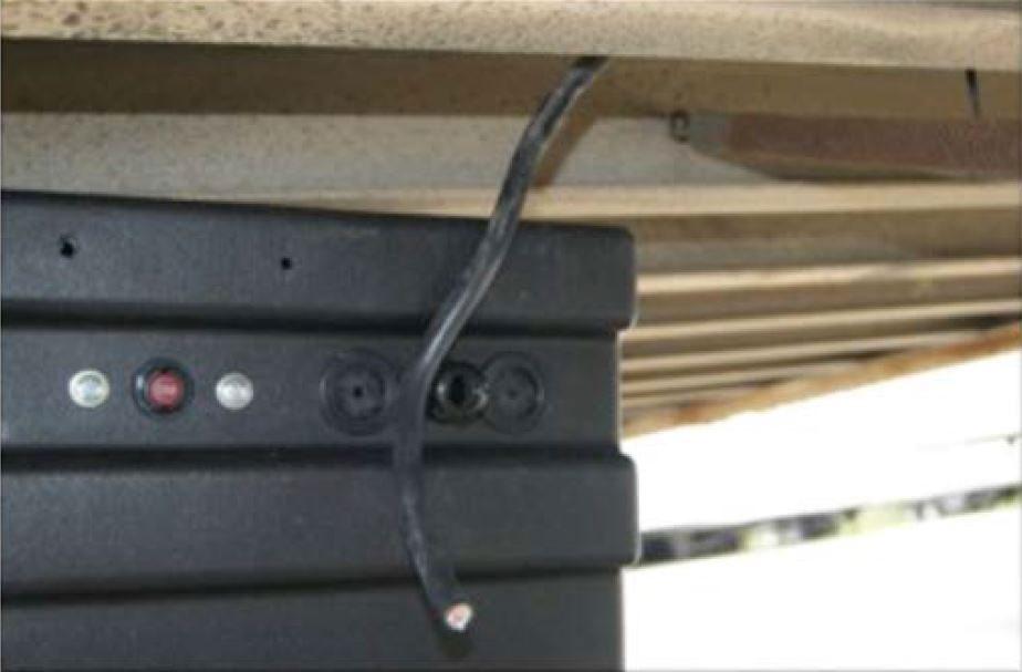Step 3: Once you are near the liftgate battery box, begin routing the Select 4-conductor main harness into the liftgate battery box through a dome nut or rubber