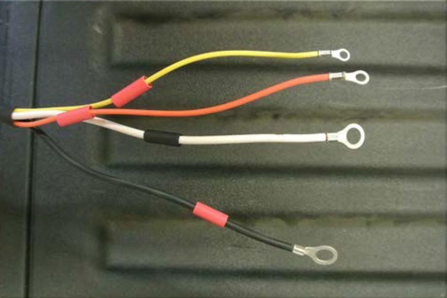 Slide the supplied black ¼ inch heat shrink over the white wire.