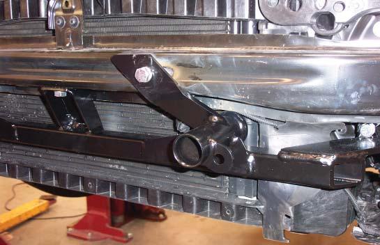 Q 13. Place the 3/16" x 1½" x 3" threaded backing plate inside the bumper core over the center mounting point (Fig.